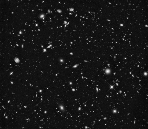 Hubble ultra-deep field image in infrared light, grayscale.